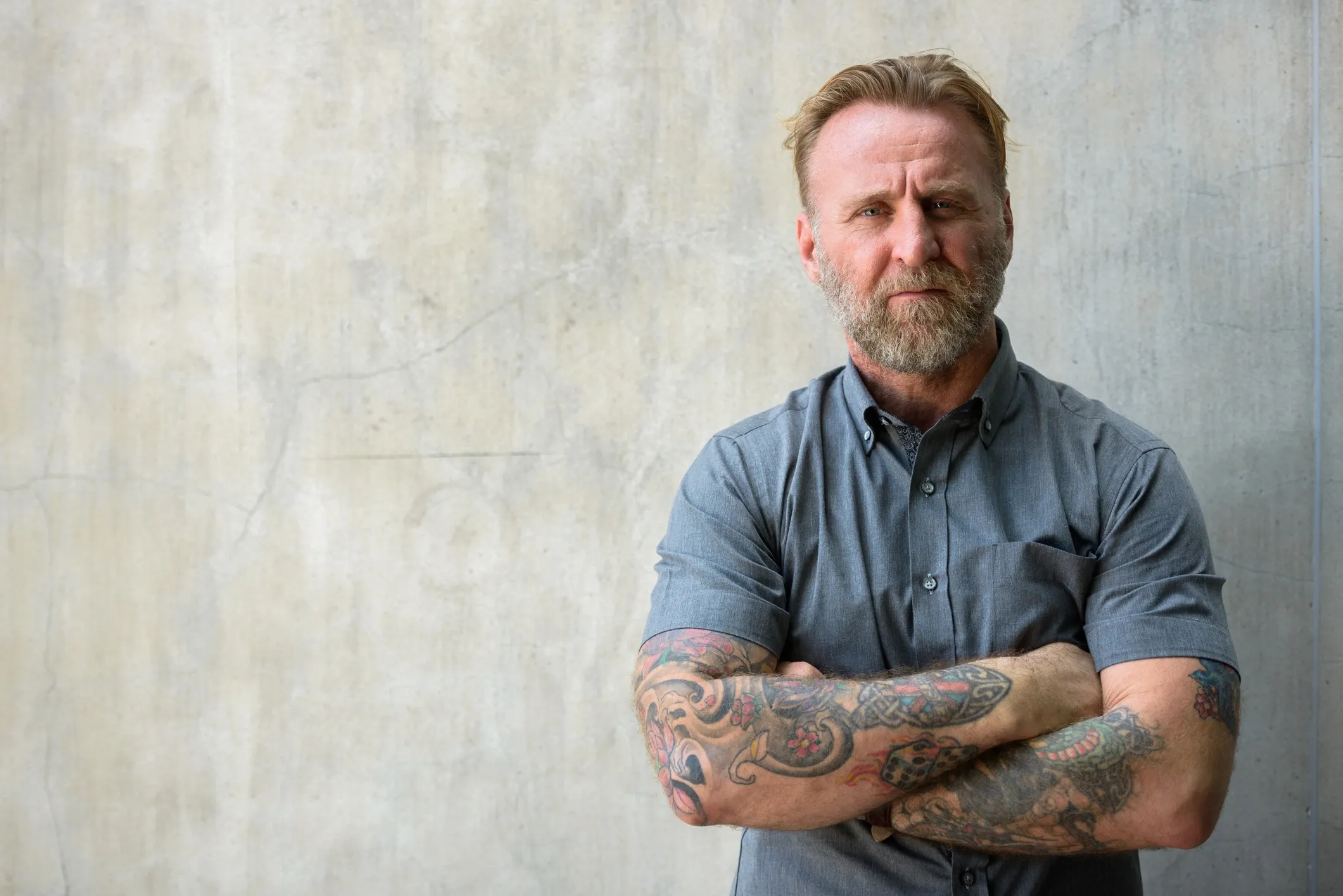 Idaho man in his 50s, arms crossed